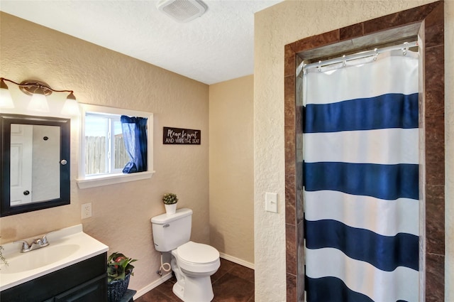 full bathroom with curtained shower, a textured wall, visible vents, toilet, and a textured ceiling
