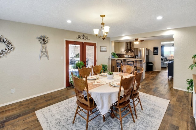 dining space featuring a textured ceiling, baseboards, and dark wood-style flooring