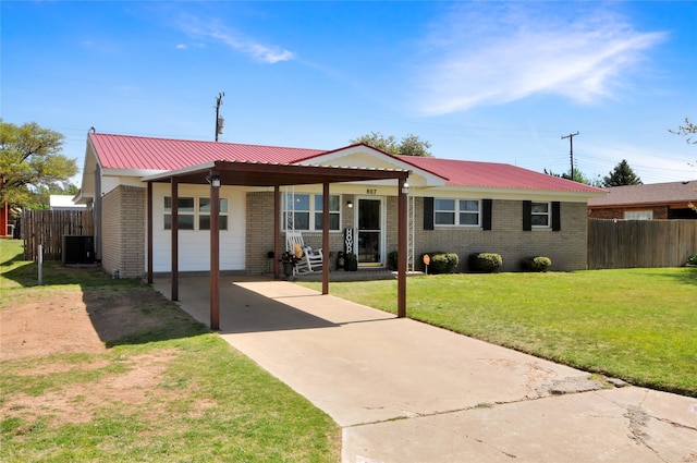 view of front of house featuring concrete driveway, brick siding, fence, and cooling unit