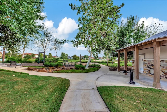 view of home's community featuring a lawn