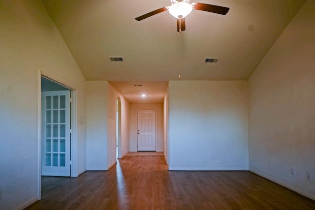 spare room with a ceiling fan, baseboards, and wood finished floors
