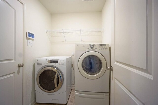 washroom with independent washer and dryer