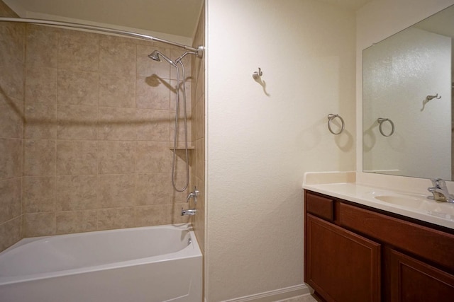 full bathroom with shower / bathtub combination, vanity, and baseboards