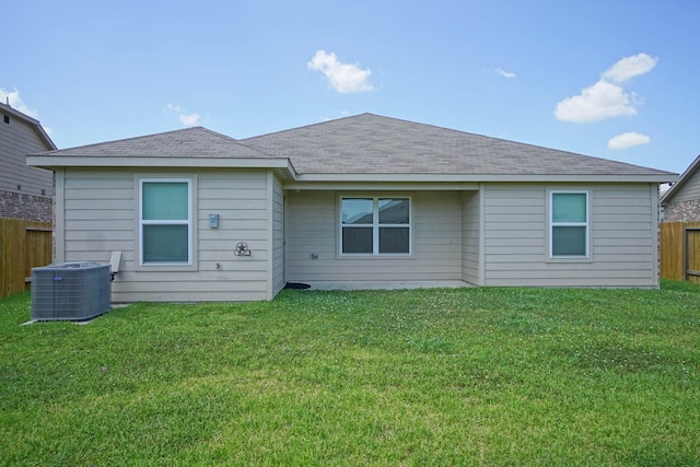 rear view of property with central AC unit