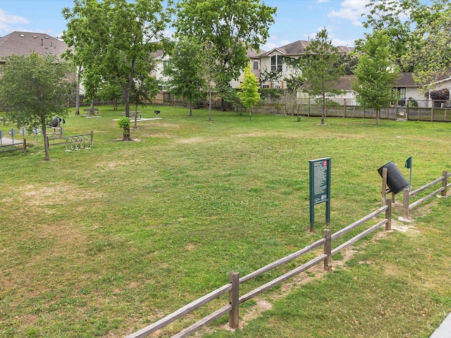 view of yard featuring a residential view and fence