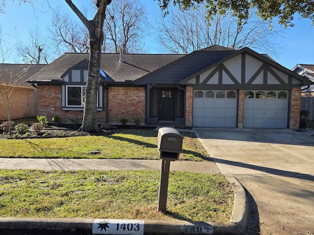1403 Hitherfield Dr, Sugar Land, TX 77498 - tudor home featuring an attached garage, brick siding, driveway, and a front yard