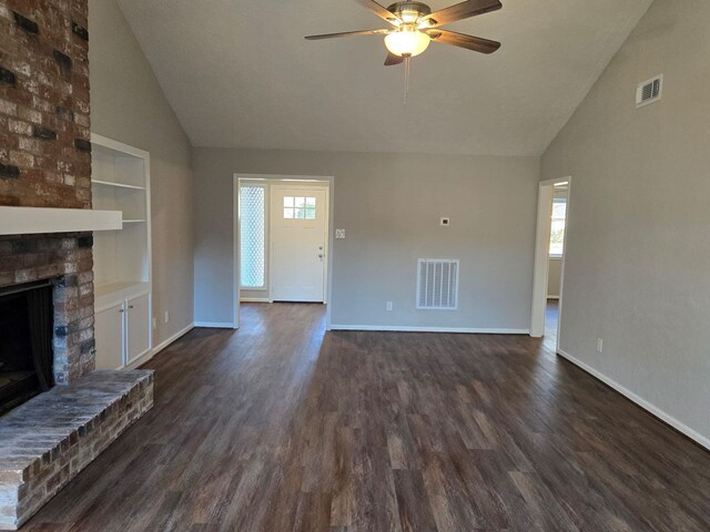 1403 Hitherfield Dr, Sugar Land, TX 77498 - unfurnished living room featuring a ceiling fan, high vaulted ceiling, a brick fireplace, dark wood-style floors, and baseboards