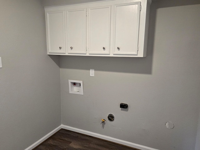 1403 Hitherfield Dr, Sugar Land, TX 77498 - washroom with gas dryer hookup, baseboards, dark wood-type flooring, washer hookup, and cabinet space