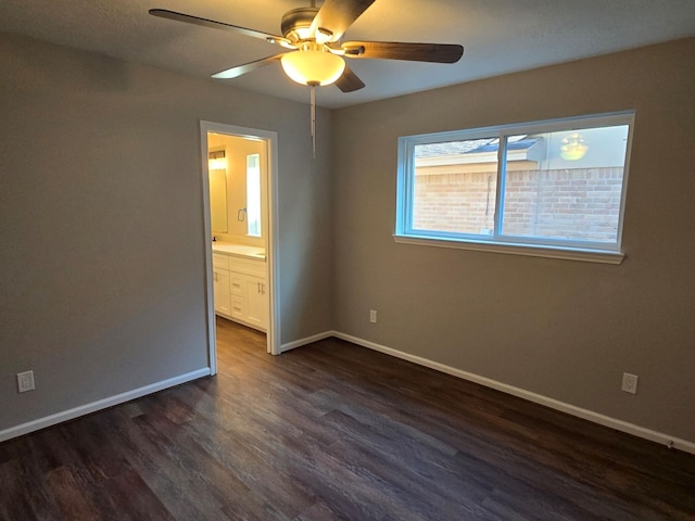 1403 Hitherfield Dr, Sugar Land, TX 77498 - unfurnished room featuring a ceiling fan, dark wood-style flooring, and baseboards