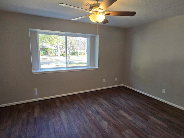 1403 Hitherfield Dr, Sugar Land, TX 77498 - empty room with wood finished floors, a ceiling fan, baseboards, and a textured ceiling