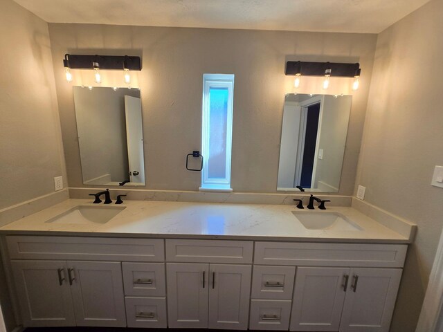 1403 Hitherfield Dr, Sugar Land, TX 77498 - bathroom featuring double vanity