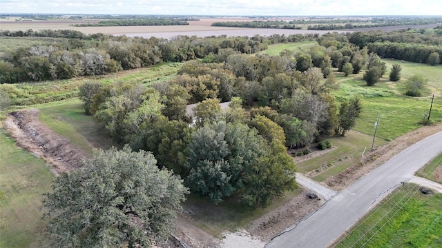 birds eye view of property with a rural view