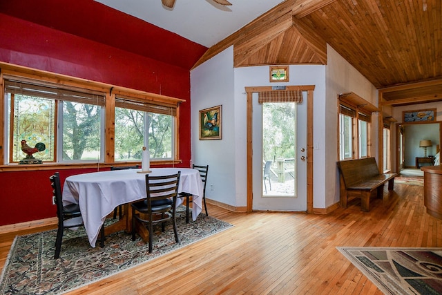 dining space with ceiling fan, lofted ceiling, light wood finished floors, and baseboards
