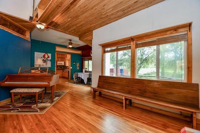 interior space featuring ceiling fan, wooden ceiling, and hardwood / wood-style floors