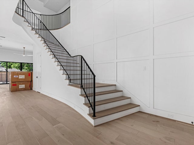 staircase featuring wood finished floors