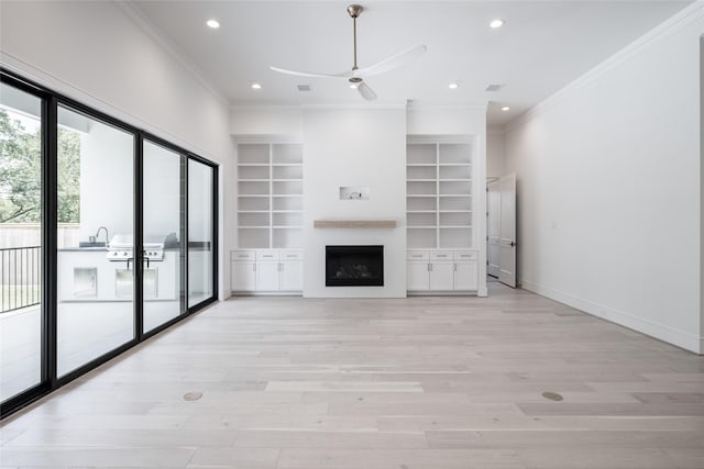 unfurnished living room with recessed lighting, ceiling fan, and ornamental molding