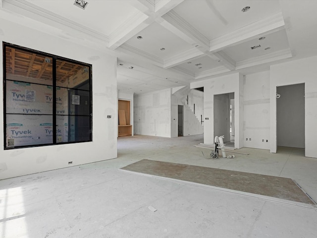 empty room featuring beamed ceiling, stairs, and coffered ceiling
