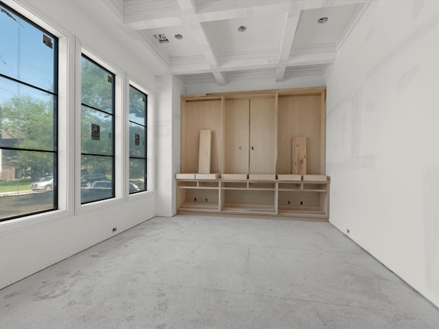 empty room with beamed ceiling and coffered ceiling