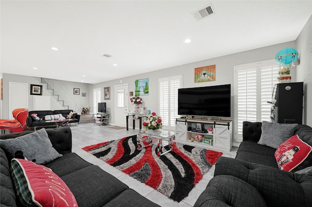 3906 Blalock Rd, Houston, TX 77080 - tiled living area featuring stairs, visible vents, and recessed lighting