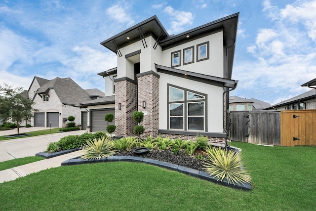 30706 Thicket Ct, Fulshear, TX 77441 - view of front facade with concrete driveway, fence, brick siding, a front yard, and stucco siding