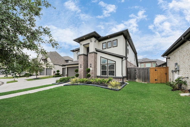 30706 Thicket Ct, Fulshear, TX 77441 - contemporary home featuring a gate, fence, concrete driveway, brick siding, and a front yard