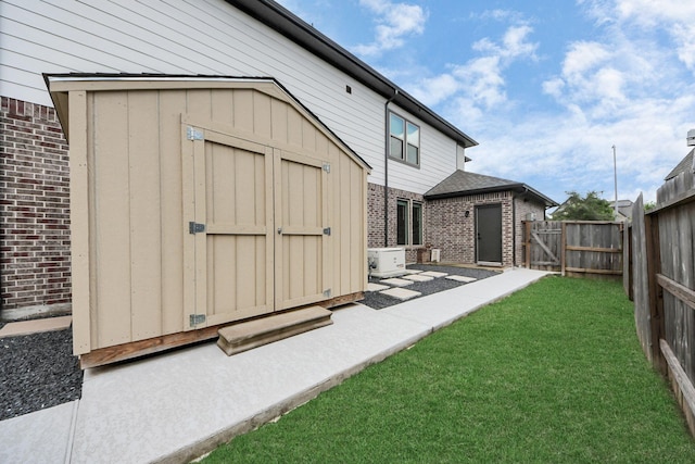 30706 Thicket Ct, Fulshear, TX 77441 - exterior space featuring fence, a storage unit, a gate, and an outbuilding