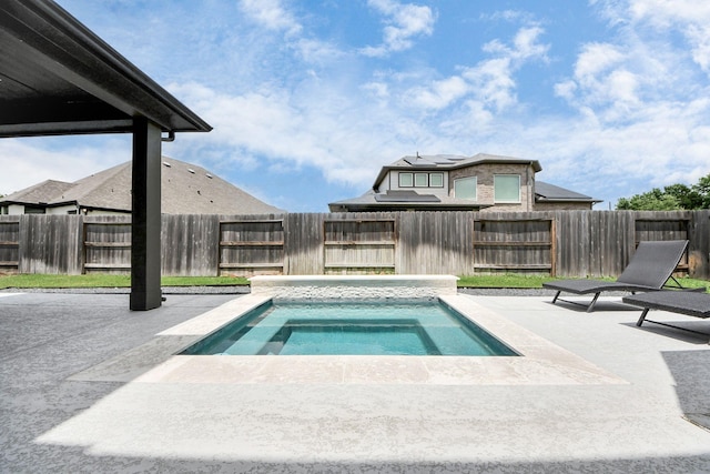 30706 Thicket Ct, Fulshear, TX 77441 - view of swimming pool with a fenced backyard, a patio, and an in ground hot tub