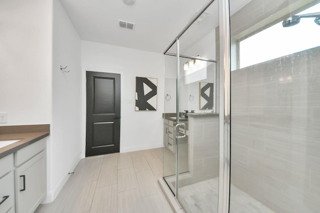 30706 Thicket Ct, Fulshear, TX 77441 - full bathroom featuring baseboards, vanity, visible vents, and a stall shower