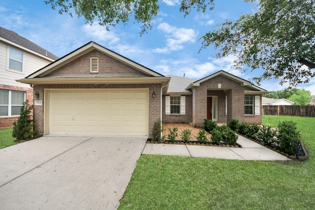single story home with brick siding, an attached garage, a front yard, and concrete driveway