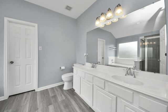 bathroom with a shower stall, visible vents, a garden tub, and a sink