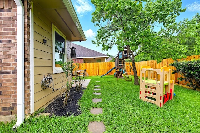 16611 River Wood Ct, Crosby, TX 77532 - view of yard with a fenced backyard and a playground