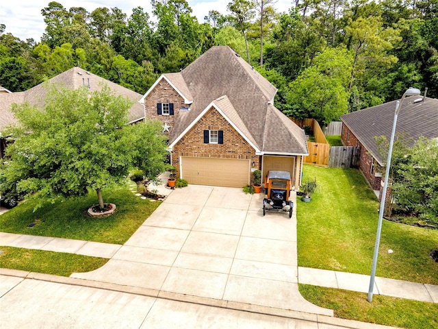 16611 River Wood Ct, Crosby, TX 77532 - craftsman house with brick siding, fence, roof with shingles, a front lawn, and concrete driveway