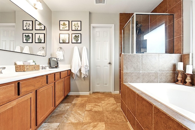 16611 River Wood Ct, Crosby, TX 77532 - full bathroom with vanity, a bath, a stall shower, visible vents, and baseboards