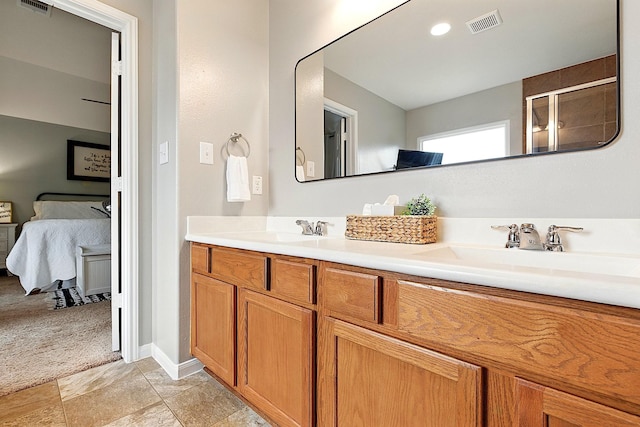 16611 River Wood Ct, Crosby, TX 77532 - ensuite bathroom featuring a sink, a shower with shower door, visible vents, and ensuite bath