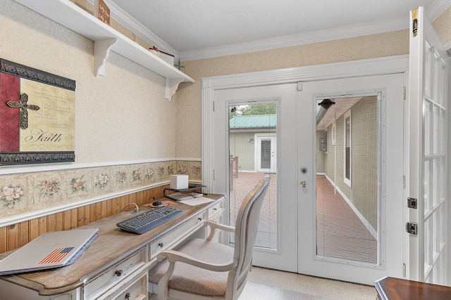 office with ornamental molding, a wainscoted wall, and french doors