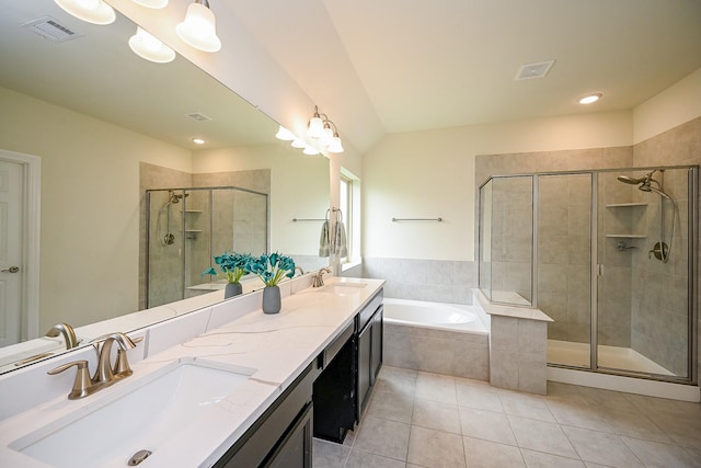 full bathroom with a stall shower, visible vents, tile patterned flooring, and a sink