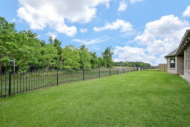 view of yard with a fenced backyard