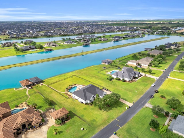 bird's eye view featuring a residential view and a water view