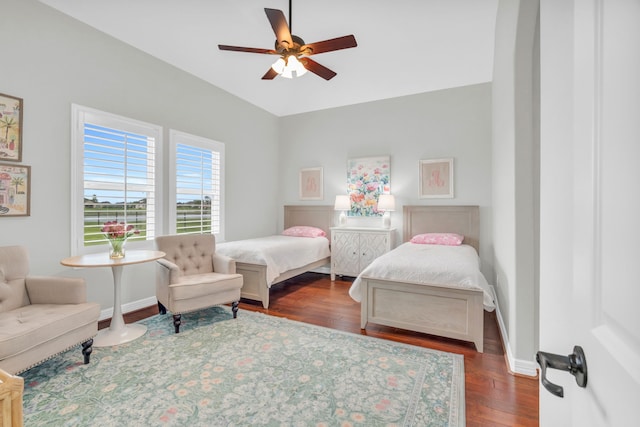 bedroom featuring wood finished floors, ceiling fan, and baseboards
