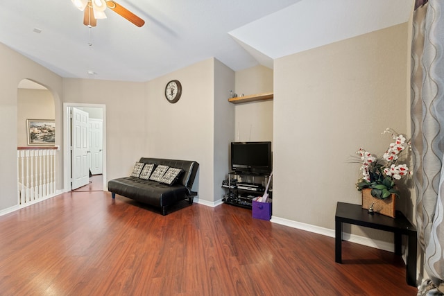 3719 Arundel Gardens Ln, Sugar Land, TX 77498 - living area featuring a ceiling fan, wood finished floors, arched walkways, and baseboards