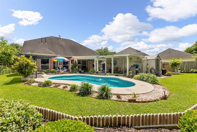 3719 Arundel Gardens Ln, Sugar Land, TX 77498 - view of swimming pool featuring a storage unit, an outbuilding, and a patio area