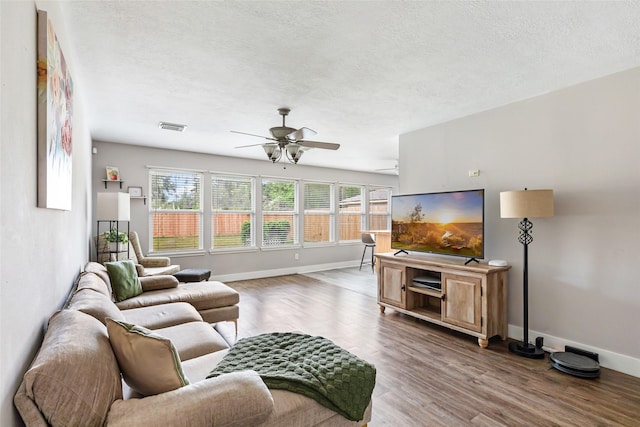 1311 N Diamondhead Blvd, Crosby, TX 77532 - living room featuring visible vents, ceiling fan, wood finished floors, and plenty of natural light