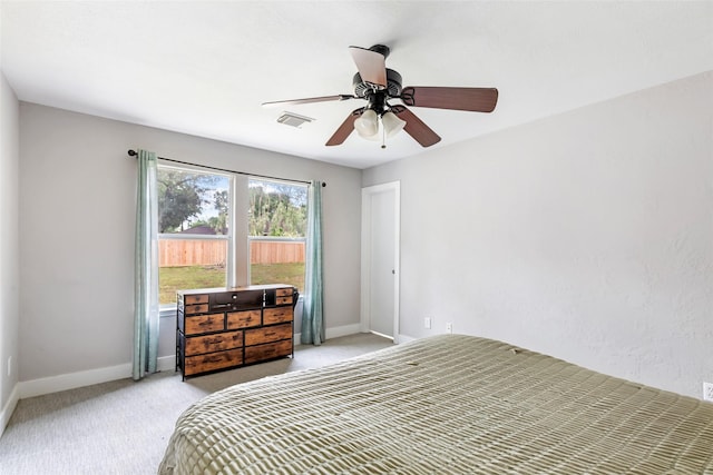 1311 N Diamondhead Blvd, Crosby, TX 77532 - bedroom featuring visible vents, ceiling fan, light carpet, and baseboards