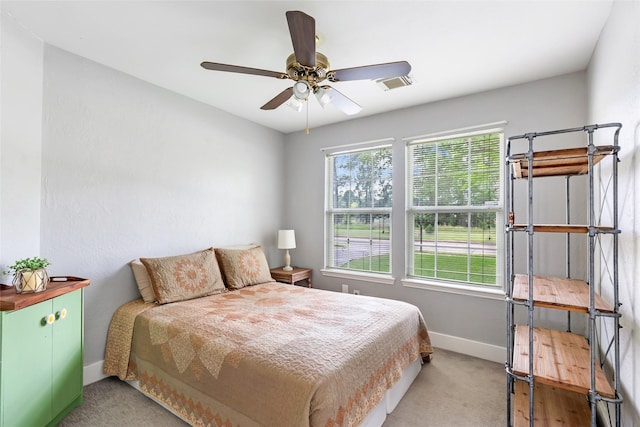 1311 N Diamondhead Blvd, Crosby, TX 77532 - bedroom with baseboards, visible vents, ceiling fan, and light colored carpet