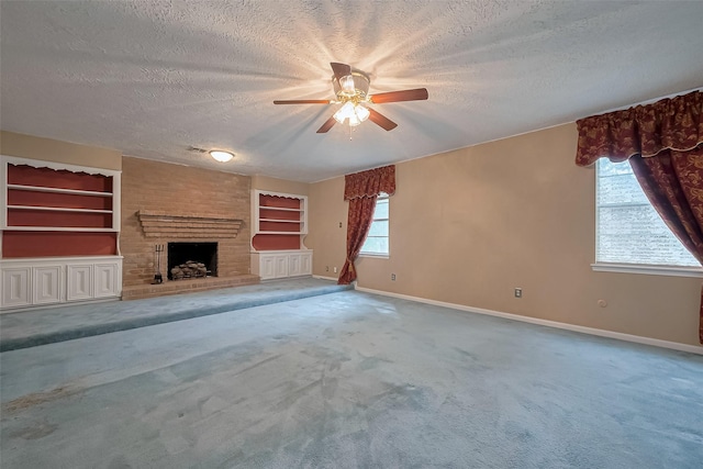 unfurnished living room featuring a textured ceiling, ceiling fan, and baseboards