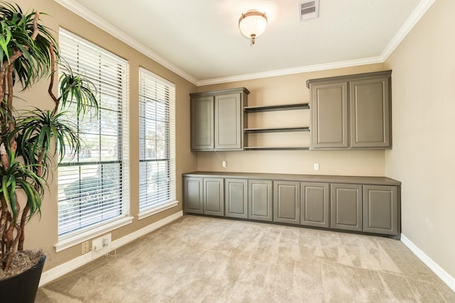 51 Scotch Pine Ct, Lake Jackson, TX 77566 - interior space featuring baseboards, visible vents, ornamental molding, and light carpet