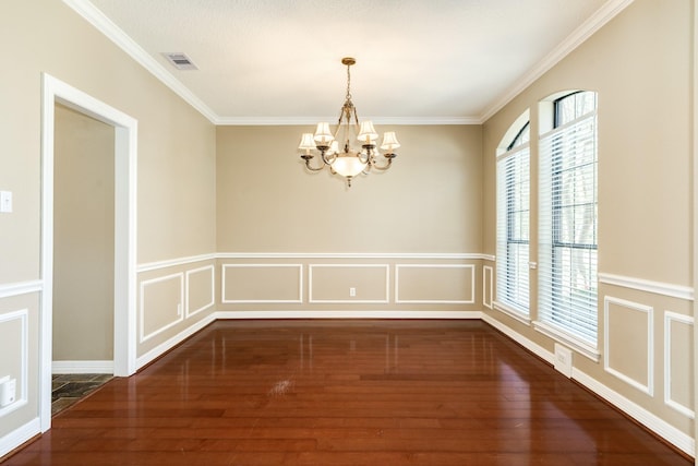 51 Scotch Pine Ct, Lake Jackson, TX 77566 - unfurnished dining area featuring wood finished floors, an inviting chandelier, crown molding, and plenty of natural light