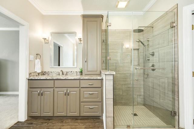 51 Scotch Pine Ct, Lake Jackson, TX 77566 - full bath featuring wood finished floors, a shower stall, crown molding, and vanity