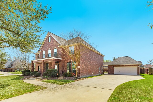 51 Scotch Pine Ct, Lake Jackson, TX 77566 - view of front of property featuring driveway, fence, a front lawn, and brick siding
