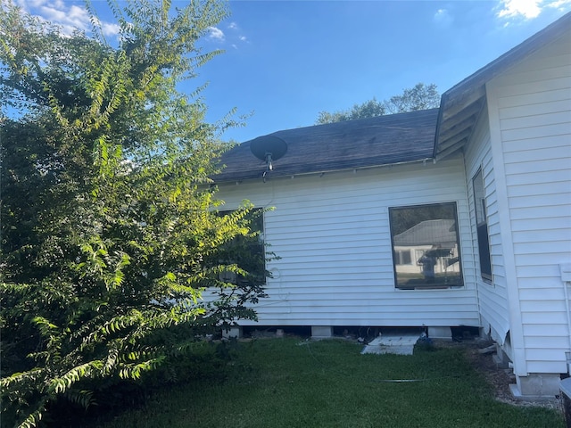 view of property exterior featuring a yard
